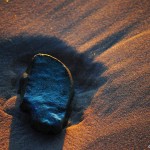 ©Michelle Potter; Stone on beach at sunset
